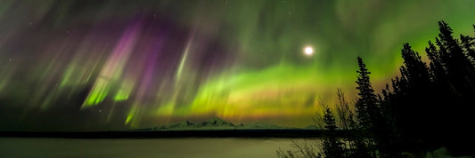 Panoramic aurora borealis over volcanic peaks of Wrangell-St. Elias, Alaska