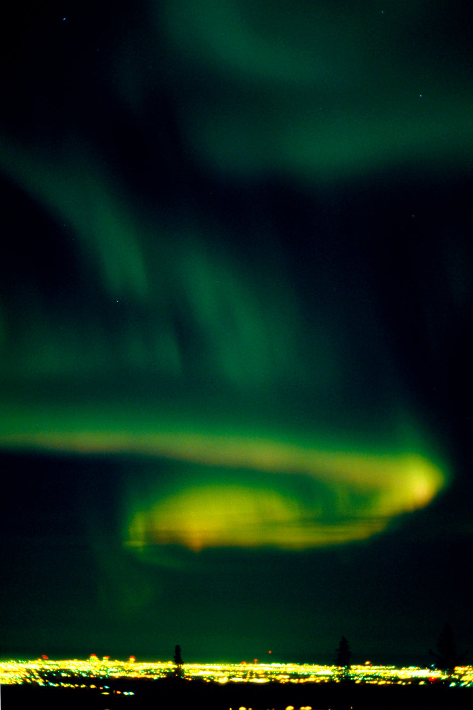 Aurora borealis resembling a glowing city of lights in Alaska's night sky