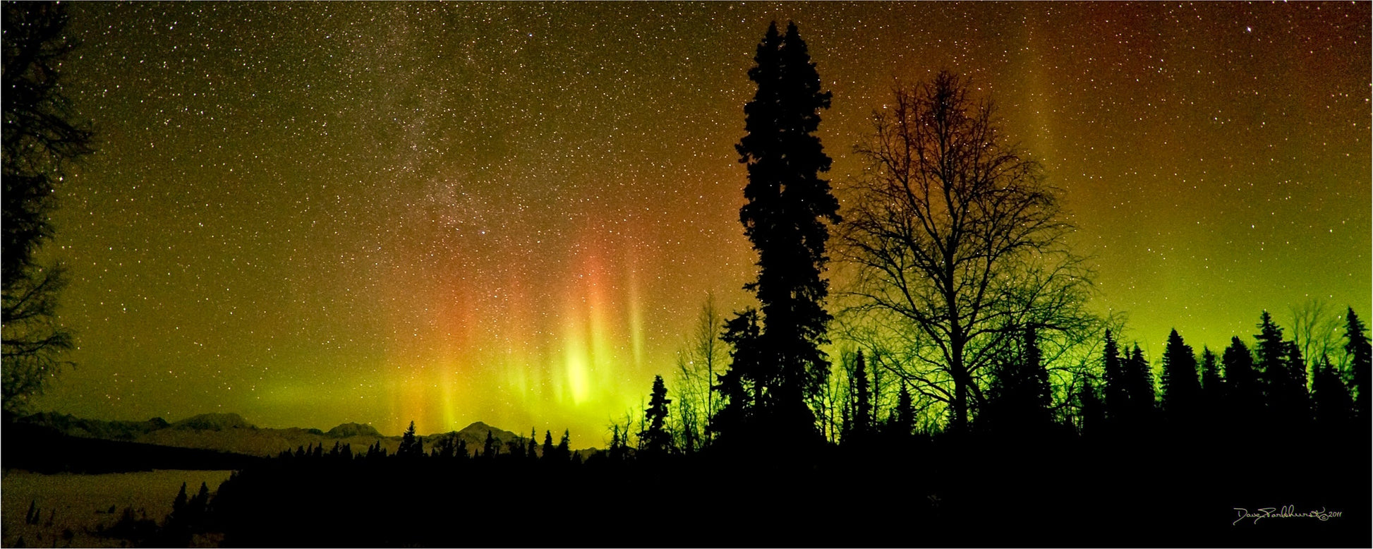 Panoramic sacred darkness over Denali with aurora borealis glowing