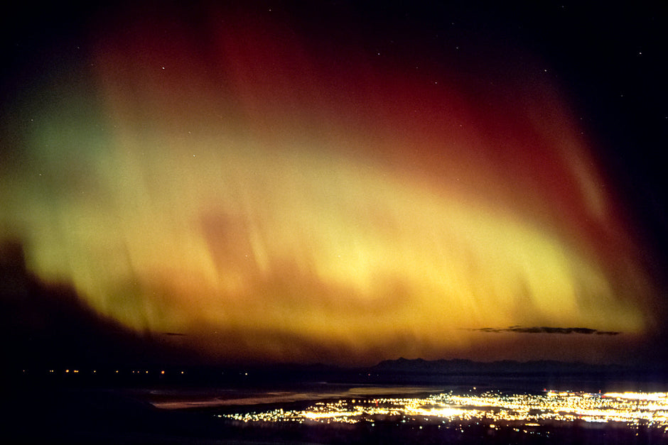 Aurora borealis lightscape glowing over Alaska's winter wilderness